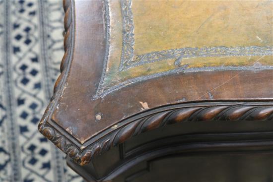 A serpentine pedestal desk, 135cm wide